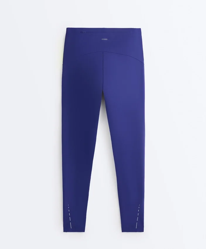 Compressive Leggings à taille haute et longueur cheville avec détails réfléchissants Compressive Leggings à taille haute et longueur cheville avec détails réfléchissants