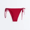 Culottes de bikini à couverture moyenne en tissu gaufré avec liens Culottes de bikini à couverture moyenne en tissu gaufré avec liens