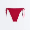 Culottes de bikini à couverture moyenne en tissu gaufré avec liens Culottes de bikini à couverture moyenne en tissu gaufré avec liens