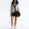 Mini-jupe compressive à taille haute et volants
