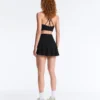 Mini-jupe compressive à taille haute et volants