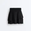 Mini-jupe compressive à taille haute et volants