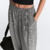 Pantalon bouffant en mélange de lyocell à carreaux vichy Pantalon bouffant en mélange de lyocell à carreaux vichy