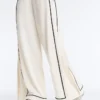 Pantalon à jambes larges en modal Soft Touch avec passepoil contrasté Pantalon à jambes larges en modal Soft Touch avec passepoil contrasté