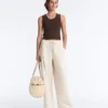 Pantalon à jambes larges en piqué plissé avec coton Pantalon à jambes larges en piqué plissé avec coton