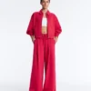 Pantalon à jambes larges en piqué plissé avec coton Pantalon à jambes larges en piqué plissé avec coton
