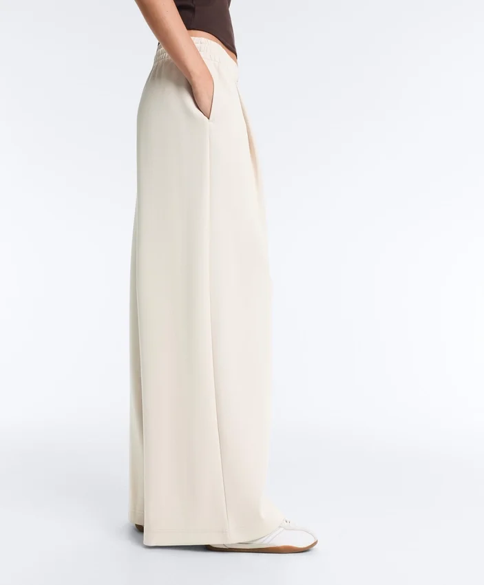 Pantalon à jambes larges en piqué plissé avec coton Pantalon à jambes larges en piqué plissé avec coton