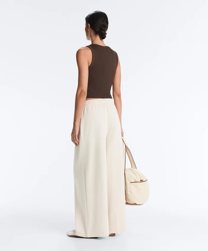 Pantalon à jambes larges en piqué plissé avec coton Pantalon à jambes larges en piqué plissé avec coton
