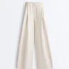 Pantalon à jambes larges en piqué plissé avec coton Pantalon à jambes larges en piqué plissé avec coton