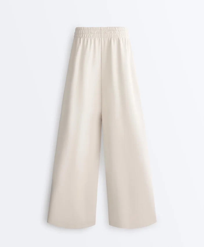 Pantalon à jambes larges en piqué plissé avec coton Pantalon à jambes larges en piqué plissé avec coton