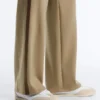 Pantalon à taille haute et coupe droite effet néoprène avec passepoil Pantalon à taille haute et coupe droite effet néoprène avec passepoil