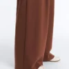 Pantalon à taille haute et jambes larges en piqué de coton Pantalon à taille haute et jambes larges en piqué de coton