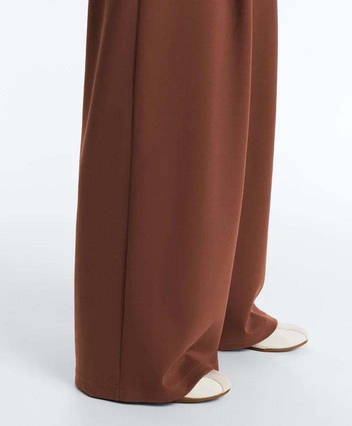 Pantalon à taille haute et jambes larges en piqué de coton Pantalon à taille haute et jambes larges en piqué de coton