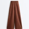 Pantalon à taille haute et jambes larges en piqué de coton Pantalon à taille haute et jambes larges en piqué de coton