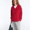 Pull à col en V en maille torsadée 100 % coton Pull à col en V en maille torsadée 100 % coton