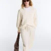 Pull à col en V en maille torsadée 100 % coton Pull à col en V en maille torsadée 100 % coton