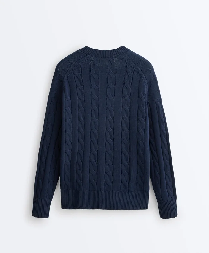 Pull à col en V en maille torsadée 100 % coton Pull à col en V en maille torsadée 100 % coton