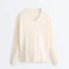 Pull à col en V en maille torsadée 100 % coton Pull à col en V en maille torsadée 100 % coton