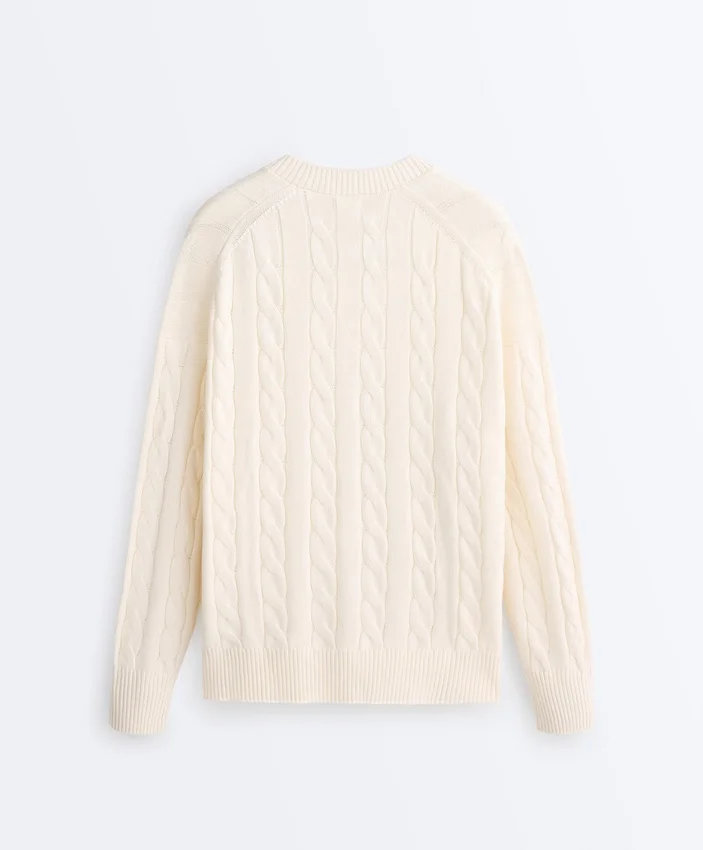 Pull à col en V en maille torsadée 100 % coton Pull à col en V en maille torsadée 100 % coton