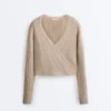 Pull en maille côtelée croisée