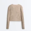 Pull en maille côtelée croisée