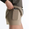 Short technique 2-en-1 à carreaux et taille mi-haute Short technique 2-en-1 à carreaux et taille mi-haute