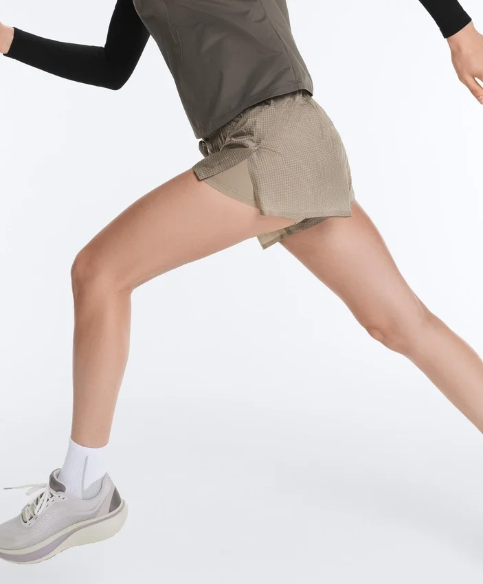 Short technique 2-en-1 à carreaux et taille mi-haute Short technique 2-en-1 à carreaux et taille mi-haute