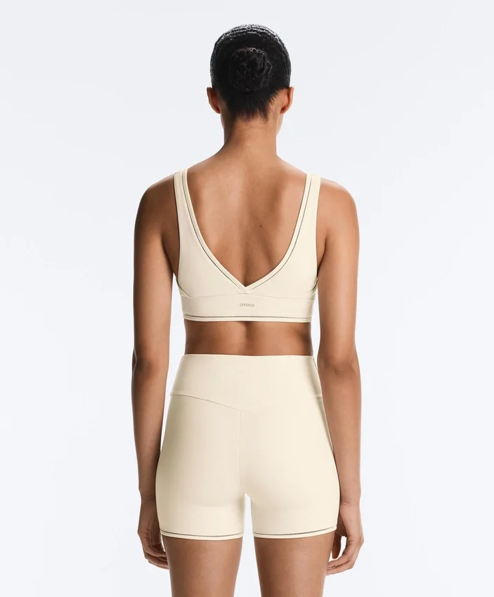 Soutien-gorge de sport Comfortlux à maintien moyen avec ourlet ajouré Soutien-gorge de sport Comfortlux à maintien moyen avec ourlet ajouré