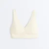 Soutien-gorge de sport Comfortlux à maintien moyen avec ourlet ajouré Soutien-gorge de sport Comfortlux à maintien moyen avec ourlet ajouré