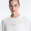 T-shirt court et carré en mélange de coton avec slogan T-shirt court et carré en mélange de coton avec slogan