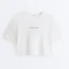 T-shirt court et carré en mélange de coton avec slogan T-shirt court et carré en mélange de coton avec slogan