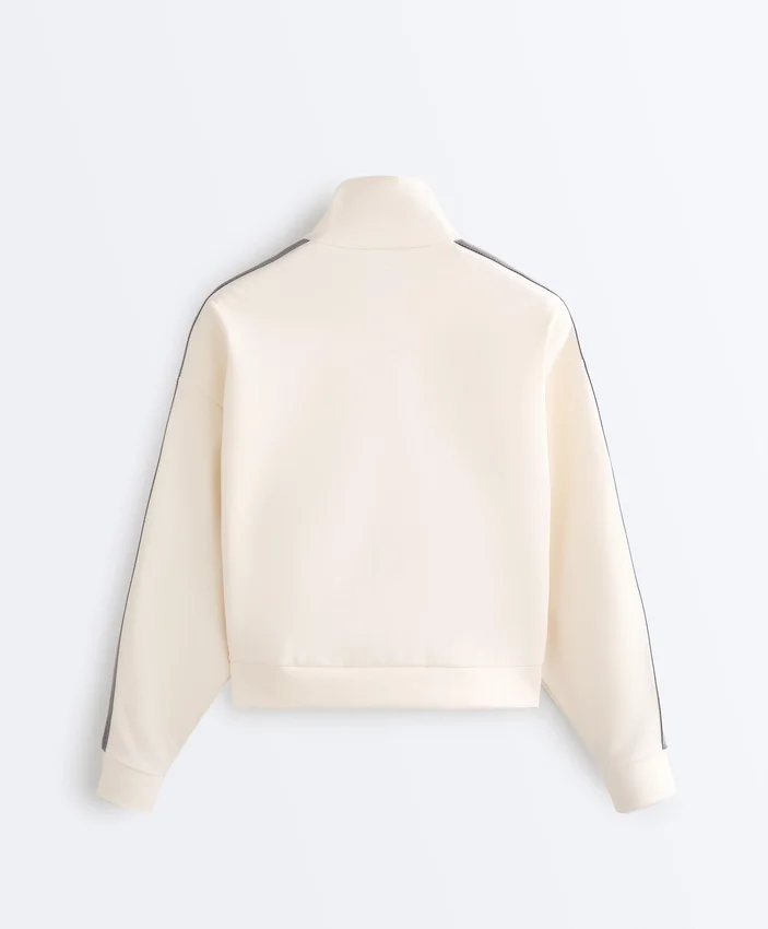 Veste en coton piqué avec bande à chevrons sur les côtés Veste en coton piqué avec bande à chevrons sur les côtés