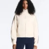 Veste en coton piqué avec bande à chevrons sur les côtés Veste en coton piqué avec bande à chevrons sur les côtés