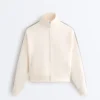 Veste en coton piqué avec bande à chevrons sur les côtés Veste en coton piqué avec bande à chevrons sur les côtés