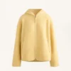 Veste en imitation peaux lainées avec capuche