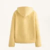 Veste en imitation peaux lainées avec capuche