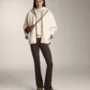 Veste en imitation peaux lainées avec capuche