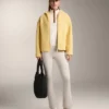 Veste en imitation peaux lainées avec capuche