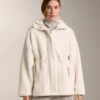 Veste en simili-peaux lainées à taille ajustable Veste en simili-peaux lainées à taille ajustable