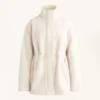 Veste en simili-peaux lainées à taille ajustable Veste en simili-peaux lainées à taille ajustable