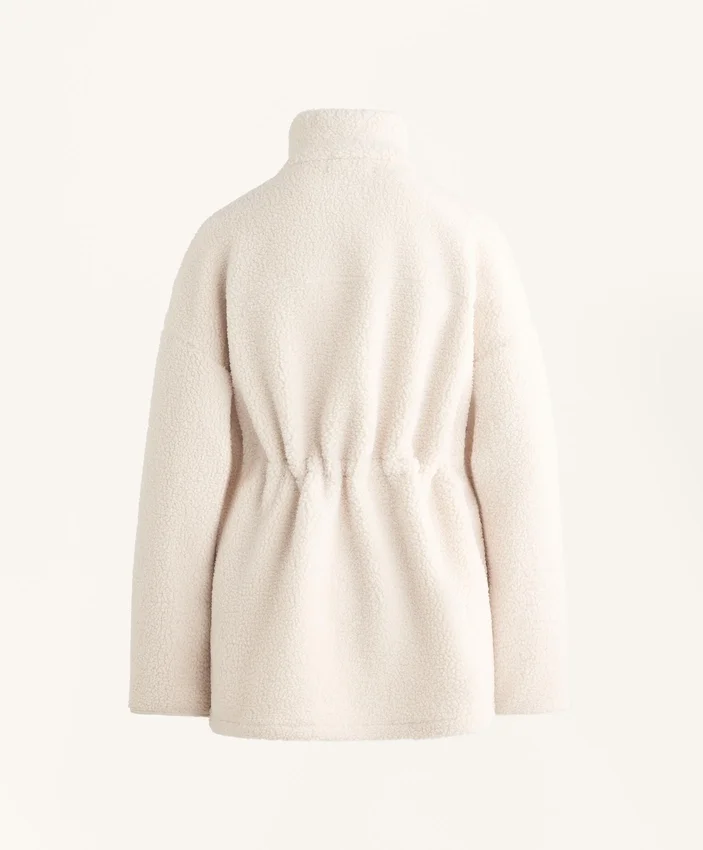 Veste en simili-peaux lainées à taille ajustable Veste en simili-peaux lainées à taille ajustable