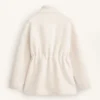 Veste en simili-peaux lainées à taille ajustable Veste en simili-peaux lainées à taille ajustable