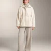 Veste en simili-peaux lainées à taille ajustable Veste en simili-peaux lainées à taille ajustable