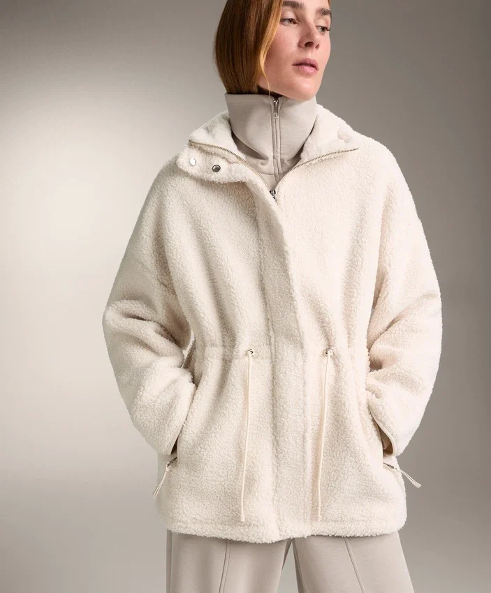 Veste en simili-peaux lainées à taille ajustable Veste en simili-peaux lainées à taille ajustable