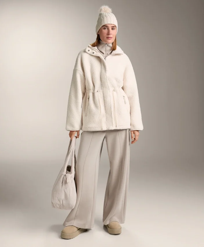 Veste en simili-peaux lainées à taille ajustable Veste en simili-peaux lainées à taille ajustable
