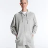 Veste longue à capuche en piqué chiné Veste longue à capuche en piqué chiné