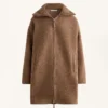 Veste longue en imitation peaux lainées Veste longue en imitation peaux lainées