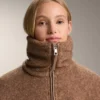Veste longue en imitation peaux lainées Veste longue en imitation peaux lainées