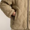 Veste matelassée en peaux lainées