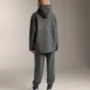 Veste oversize en peaux lainées avec capuche doublée de fausse fourrure Veste oversize en peaux lainées avec capuche doublée de fausse fourrure